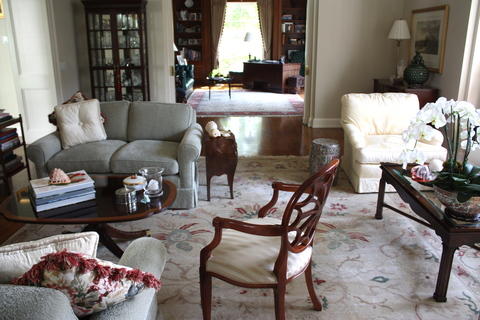 Traditional Living Room with large light colored floral area rug