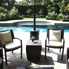 Contemporary Pool with black patio furniture