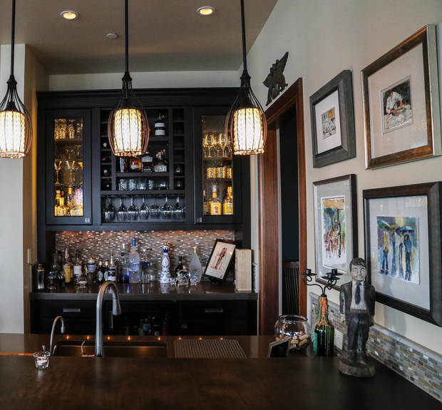 Art Deco Kitchen in Moorpark black solid surface counter, lighting in