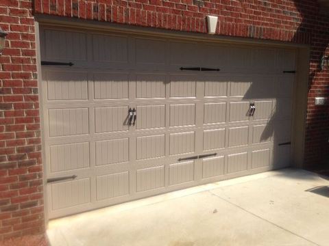 Transitional Garage with brown panel garage door