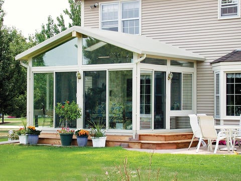 Traditional Sunroom with sliding glass doors