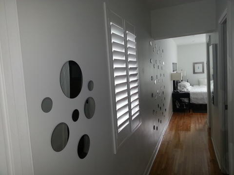 Modern Bedroom with round mirrors on wall