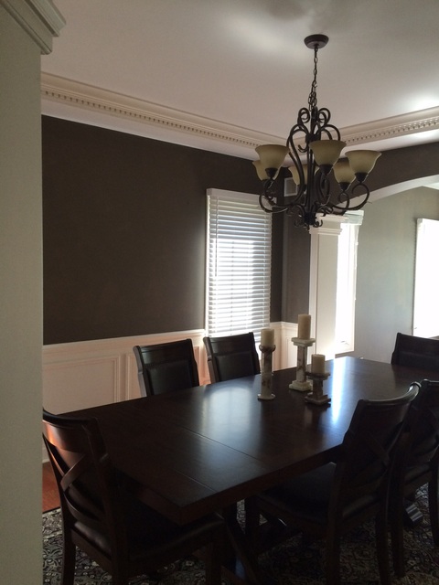 Transitional Dining Room with oil rubbed bronze chandelier