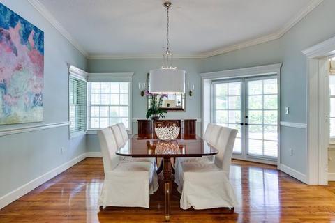 Transitional Dining Room with white slip cover dining chair