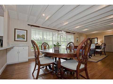 Transitional Dining Room with white ceiling beams