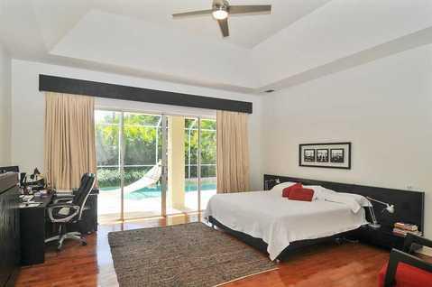 Contemporary Bedroom with propeller style ceiling fan and light