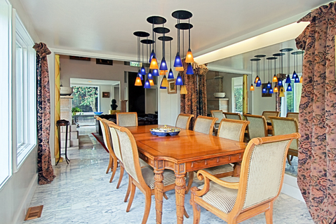 Modern Dining Room with pendant lights with colorful shades