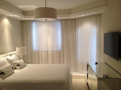 Contemporary Bedroom with white bed covers and accents