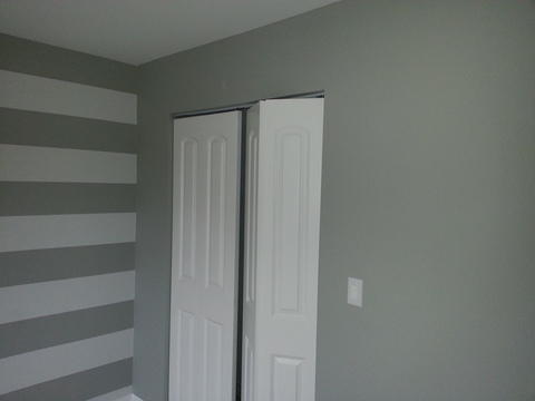 Transitional Bedroom with white painted closet doors