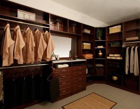Traditional Closet with dark wood closet organization