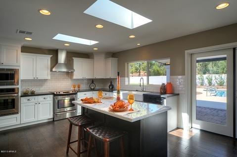 Modern Kitchen with brushed stainless steel range hood