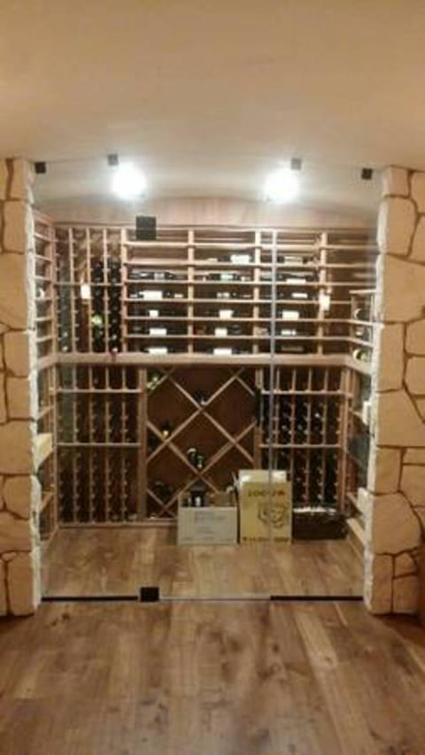 Modern Wine Cellar with frameless glass door