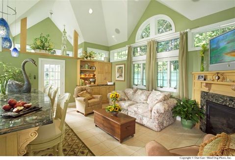 Eclectic Family Room with granite fireplace surround