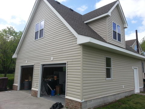 Transitional Garage with beige painted siding