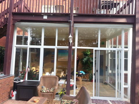 Contemporary Sunroom with vinyl window and wall casement