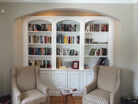 Transitional Library with grey and white armchair