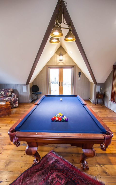 Eclectic Library with large pool table with blue felt