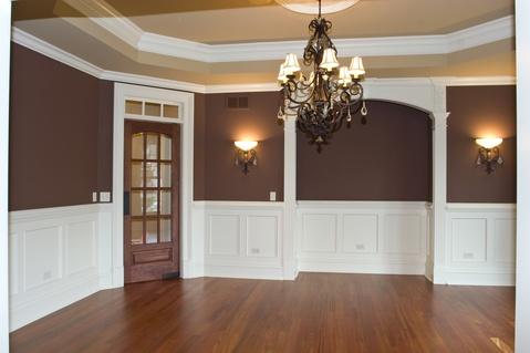Transitional Dining Room with white painted wainscoting