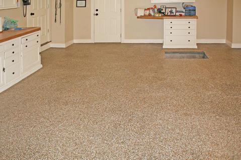 Transitional Garage with garage with epoxy floor and cabinetry