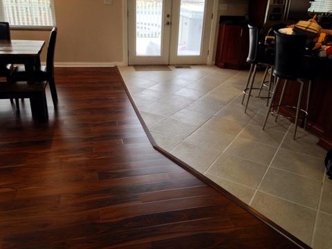 Transitional Dining Room with dark stained hardwood floor