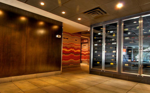 Contemporary Wine Cellar with antiqued gold wallpaper or laminate panels