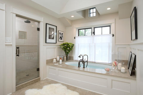 Transitional Bathroom with beige solid surface bathtub surround