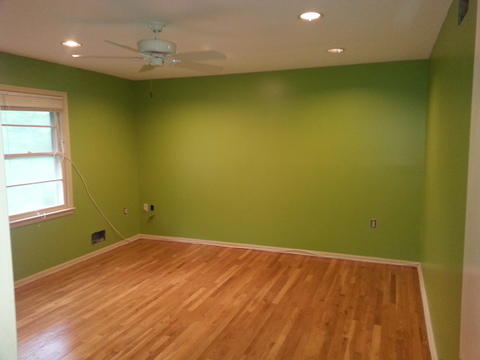Casual / Comfortable Bedroom with bright green painted walls