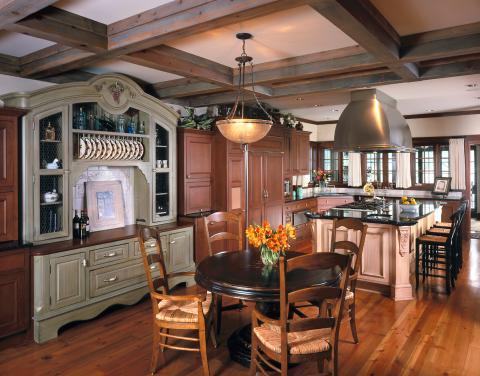 Traditional Kitchen with large exposed ceiling hung range hood