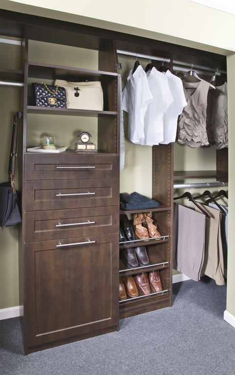 Traditional Closet with dark wood recessed panel cabinetry