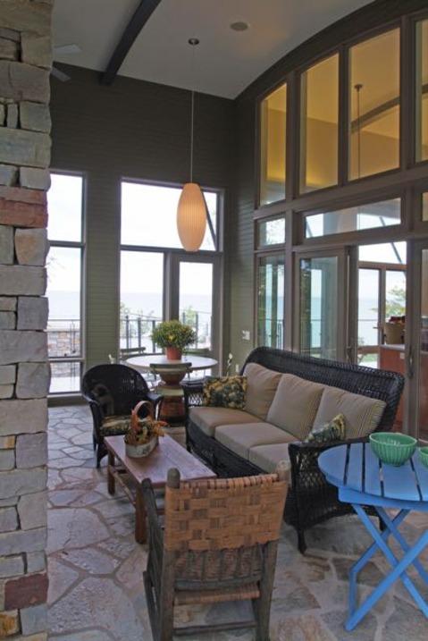 Contemporary Sunroom with bright blue occasional table