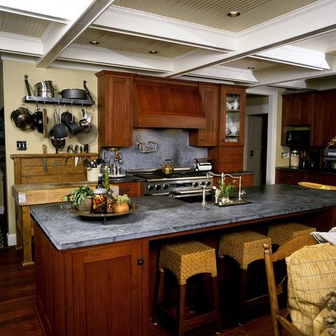 Eclectic Kitchen with medium stained recessed wood cabinetry