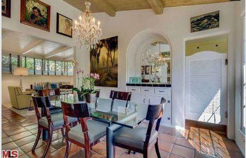 Eclectic Dining Room with arched nook with mirror and wall sconce
