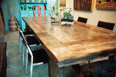 Eclectic Dining Room with rustic wood plank dining table