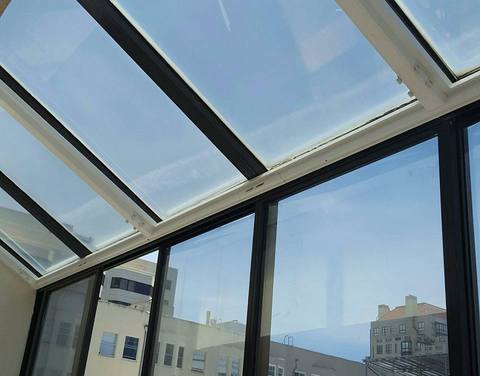 Contemporary Sunroom with aluminum frame windows