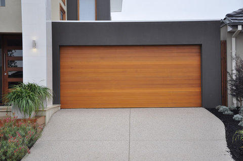 Modern Garage with full length wood plank garage door