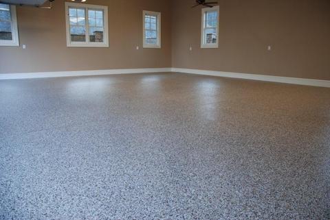 Transitional Garage with speckled gray epoxy floor treatment