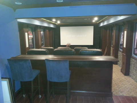 Traditional Home Theater with stacked stone wainscoting