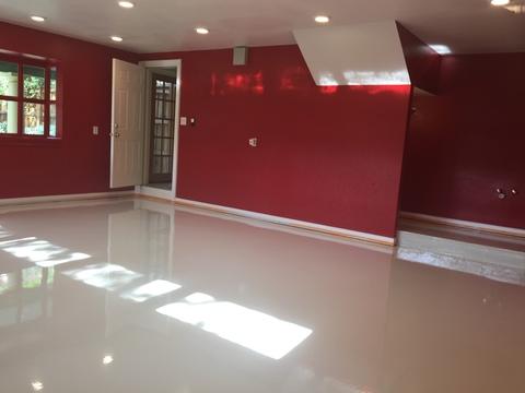 Transitional Garage with high gloss painted floors