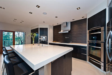 Modern Kitchen with white solid surface countertop