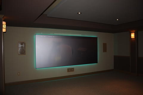 Traditional Home Theater with wall mounted projection screen