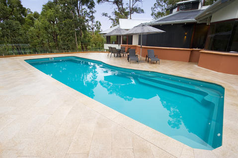 Contemporary Pool with terra cotta exterior paint