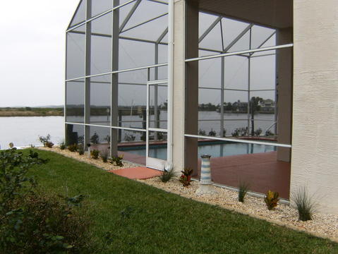 Contemporary Home Exterior with exterior glass walls