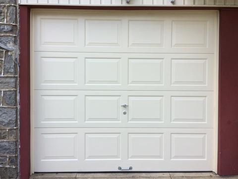 Transitional Garage with single bay garage door