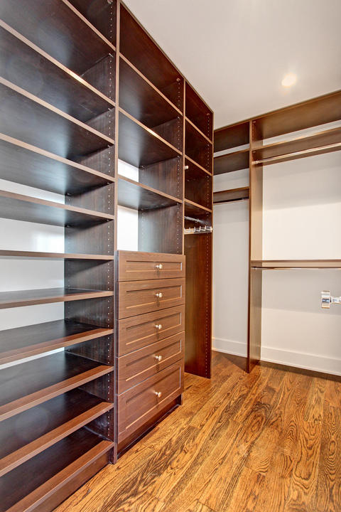 Traditional Closet with wood recessed panel drawers