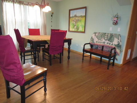 Traditional Dining Room with medium stained dining table top with black legs