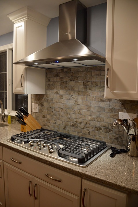 Modern Kitchen with stainless steel range hood