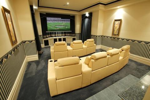 Traditional Home Theater with plush blue wall to wall carpet
