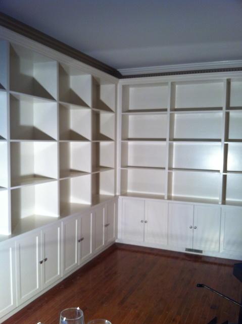 Transitional Library with white cabinetry with recessed panels