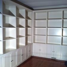 Transitional Library with white cabinetry with recessed panels