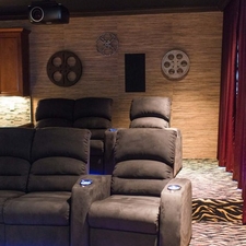 Eclectic Home Theater with under chair neon lighting